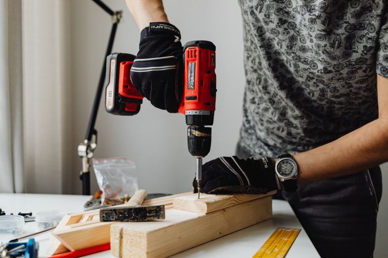 a man performing a DIY home project